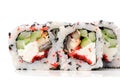 Yummy Japanese fusion rolls with sesame seeds topped with red ro