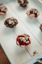 Yummy muffins with chocolate and berry syrup