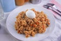 Yummy Nigerian Jollof Rice served with a boiled egg and chopped meat