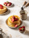 Yummy pancakes with strawberry and honey on kitchen table in cosy rustic composition. American breakfast concept