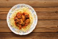 Yummy spaghetti with meatballs in tomato sauce on wooden table Royalty Free Stock Photo