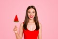 Yummy Sweet summer Close up portrait of attractive lovely woman holding piece on caramel fruit on stick, isolated on