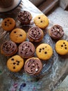 Yummy yellow chocolate cupcakes fresh baked in a breakfast with cream food dessert sweet photography