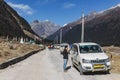 Yumthang Valley with road line and tourist cars in winter at Lachung. North Sikkim, India