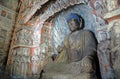 Buddha statue with blue hair at Yungang Grottoes near Datong in Shanxi Province, China Royalty Free Stock Photo