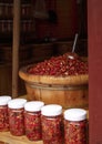 Yunnan chili in jars and in bulk in traditional wood bucket in Lijiang, Yunnan Royalty Free Stock Photo