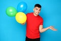 Yuong man with balloons Royalty Free Stock Photo