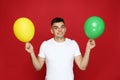 Yuong man with balloons Royalty Free Stock Photo