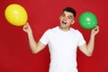 Yuong man with balloons Royalty Free Stock Photo