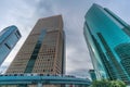 Yurikamome line train running through skyscraper buildings near Higashi-Shimbashi Area. Shiodome Tower, Royal Park Hotel Tower, an Royalty Free Stock Photo