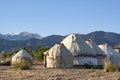 Yurt nomadic houses camp at mountain valley in Central Asia. Kyrgyz yurt in the middle of the mountains, Isikul area, Kyrgyztan