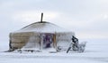 Yurt in the snow with a motorcycle in mongolia