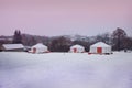 Yurts in the archaeological park `Argamach` in the winter early in the morning, Russia