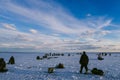 YURYEVETS, RUSSIA - MARCH 27, 2019: Men fishermen fishing in winter on the ice Royalty Free Stock Photo