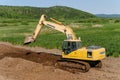 Komatsu PC200 excavator working on the side of the road.