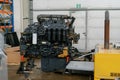 Disassembled Komatsu loader engine is under repair.