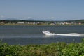 People moving on a speedboat on dust Royalty Free Stock Photo