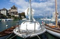 Yvoire, France - September 2016: Sailing boats moored with their sails furled in a pretty lakeside harbour on Lake Geneva. Royalty Free Stock Photo