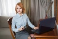 YYoung pretty business woman with laptop in the hotel room Royalty Free Stock Photo