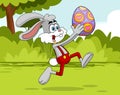 Happy Rabbit Cartoon Character Running With Colored Easter Egg Royalty Free Stock Photo