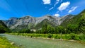 The Zaalach River and the power lines above it in the alpine mountains Royalty Free Stock Photo