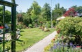 Garden shed surrounded by a beautiful decorative garden