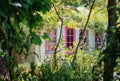 Garden shed surrounded by a beautiful decorative garden