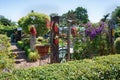 Garden shed surrounded by a beautiful decorative garden