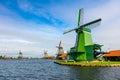 Famous Dutch village with windmills, Agricultural historical landscape. Tourism. Popular Holland, Netherlands, Europe