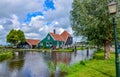 Zaanse Schans, Holland, August 2019. Northeast Amsterdam is a small community located on the Zaan River. View of the pretty wooden Royalty Free Stock Photo