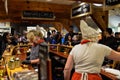 Zaanse Schans, Holland, August 2019. Tasting of typical Dutch cheeses: along the counter there are saucers with cubes of cheese to