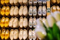 ZAANSE SCHANS, NETHERLANDS. November 2020. Wooden tulips with Dutch traditional colorful handmade wooden shoes, clogs