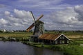 A wooden windmill attached to a cottage in Zaanse Schans. Royalty Free Stock Photo