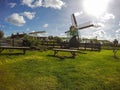 Zaanse schans windmill with green grass and blue sky Royalty Free Stock Photo