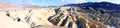 Zabriski Point Death Valley - panorama of rocks forms in sunny blue sky day Royalty Free Stock Photo