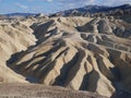 Zabriski Point Death Valley - rocks forms in sunny blue sky day Royalty Free Stock Photo