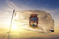 Zacatecas state of Mexico flag textile cloth fabric waving on the top sunrise mist fog
