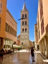 Ourists walking down the main street toward the famous Bell Tower in the old town of Zadar, Croatia