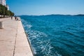 Zadar, Croatia - July 26 2018: Waterfront in the old town of Zadar. People enjoing a summer day by the sea