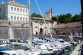 Zadar, Croatia; 07/17/2019: Lucica Fosa Zadar harbour full of boats with the Gate of Terraferma or Gate of Zara at the Royalty Free Stock Photo