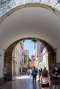 Zadar, Croatia; 07/17/2019: Vertical picture of the arch of Bridge Gate and Jurja Barakovica street in the old town of Zadar,