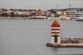 Zadar Port Lighthouse surrounded by the sea and buildings in Croatia Royalty Free Stock Photo