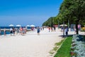 Zadar waterfront with the Mediterranean Sea in front, people walking and some green trees