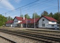 Zadni Treban, Czech republic, May 8, 2020: railway station Zadni Treban with white red roof building, track, trains and