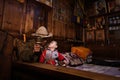 Tibetan grandfather holding his grandchild at home in Zhagana, China