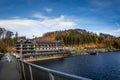 Autumnal landscape with Bystrzyckie lake and Maria Antonina hotel building, Poland. Royalty Free Stock Photo