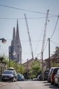 Workers with tall cranes fixing Zagreb Cathedral tower