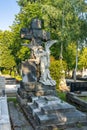 Zagreb, Croatia - Aug 9, 2020: Stone grave with large angel statue in Mirogoj cemetery