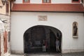 Tourists passing by Kamenita vrata, the Zagreb stone gate, a gate in the gornji grad upper town of the medieval city of Zagreb Royalty Free Stock Photo