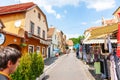 Street in Opatovina district with insignificant people and bars and outdoor retail